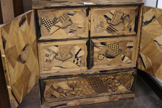 A Japanese parquetry chest/cabinet W.54cm